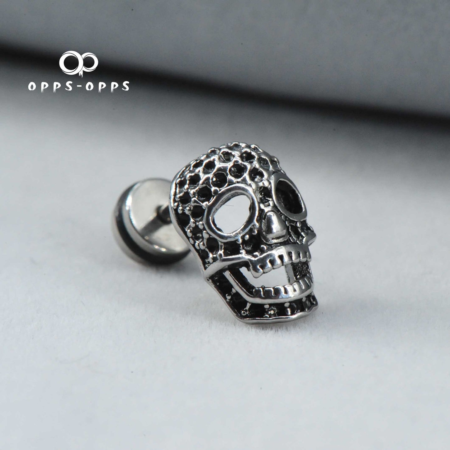 SKULL CARVING STUD EARRING