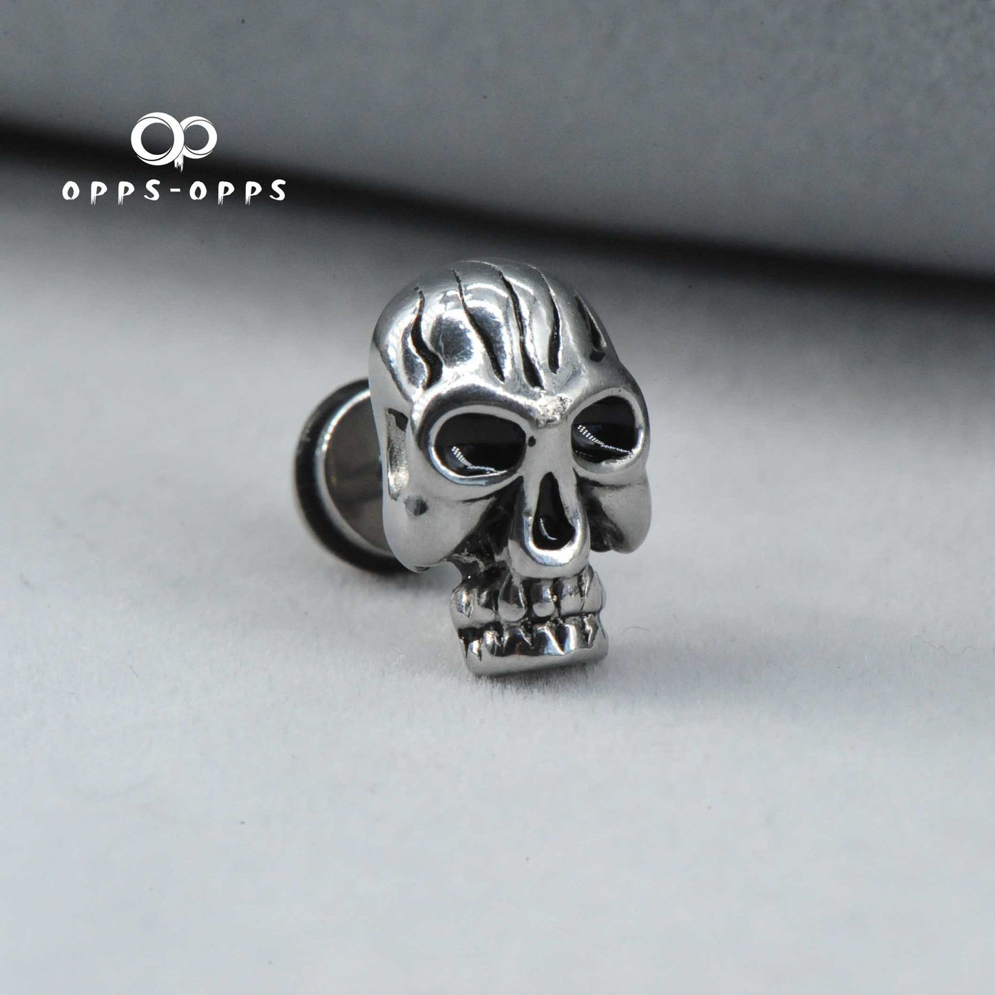 SKULL CARVING STUD EARRING